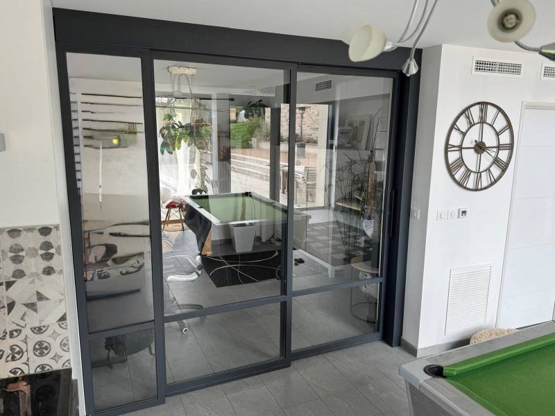 Verrière coulissante acier et verre sur mesure réalisée par artisan métallier près de Lyon